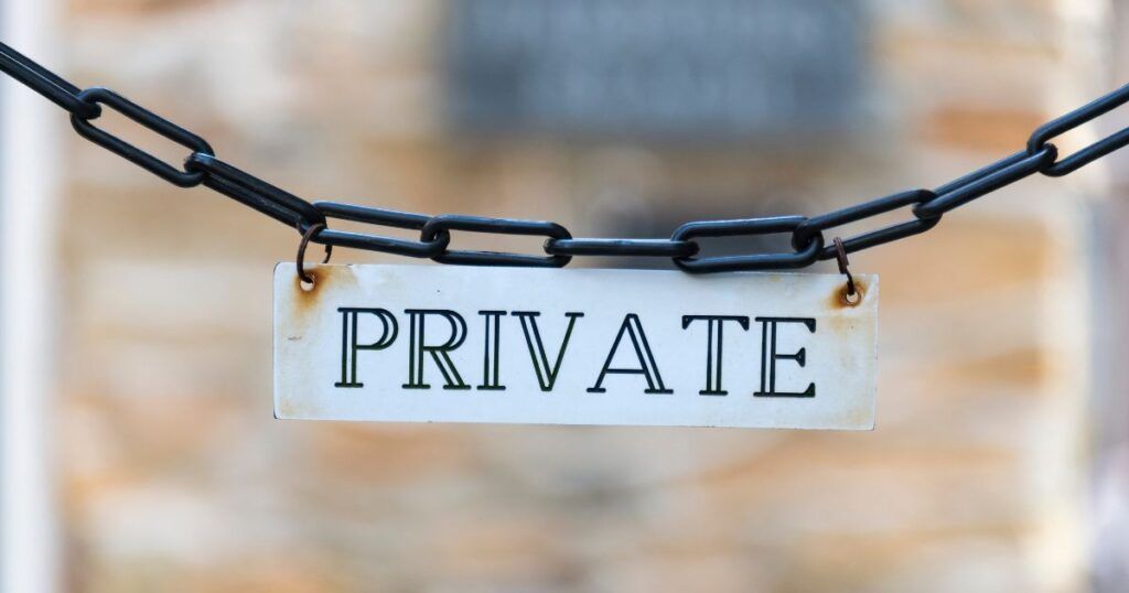 a chain holding a sign marking "private"