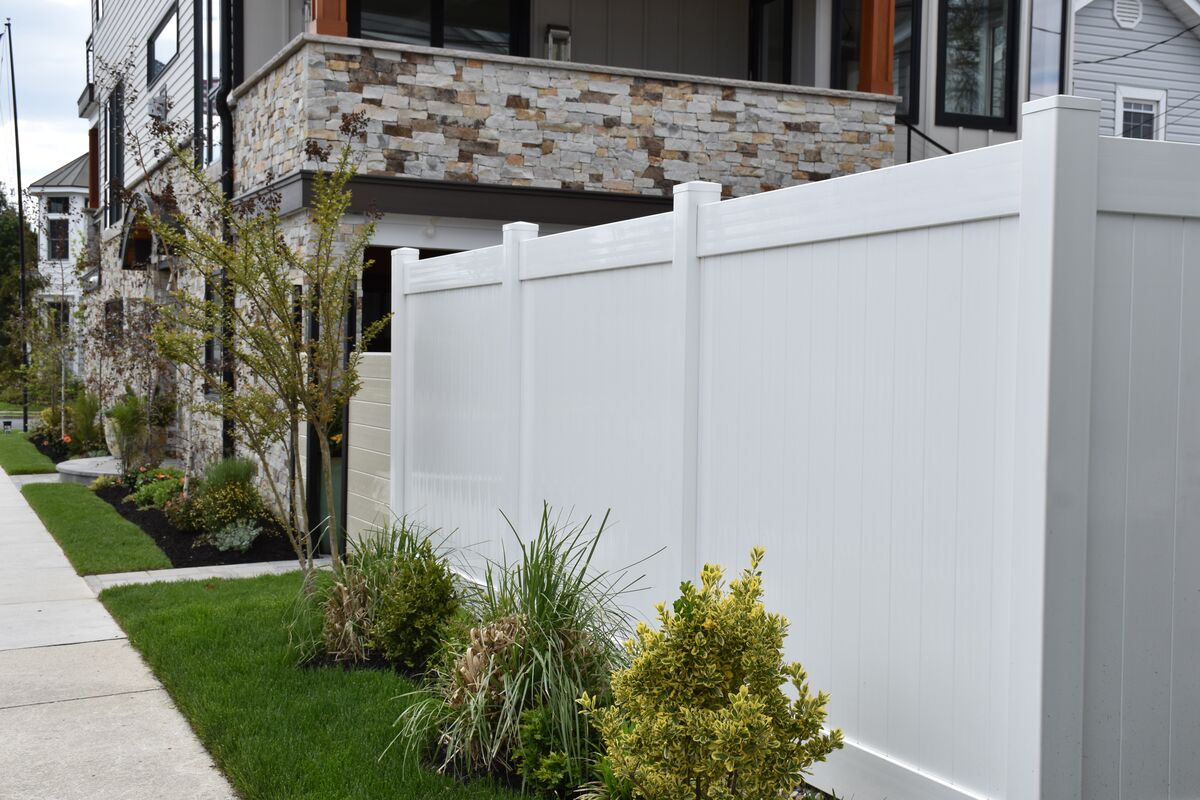 White residential Vinyl privacy fence